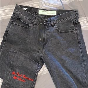 off white black jeans with red logo embroidering